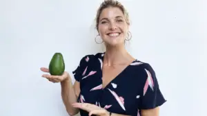 Abbey holding an avocado